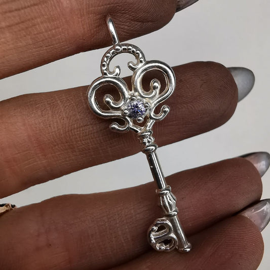 Silver Key Pendant With Sapphire