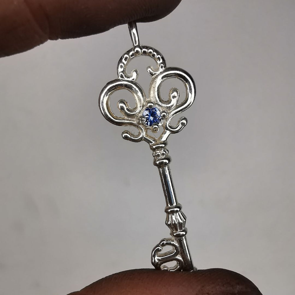 Silver Key Pendant With Sapphire