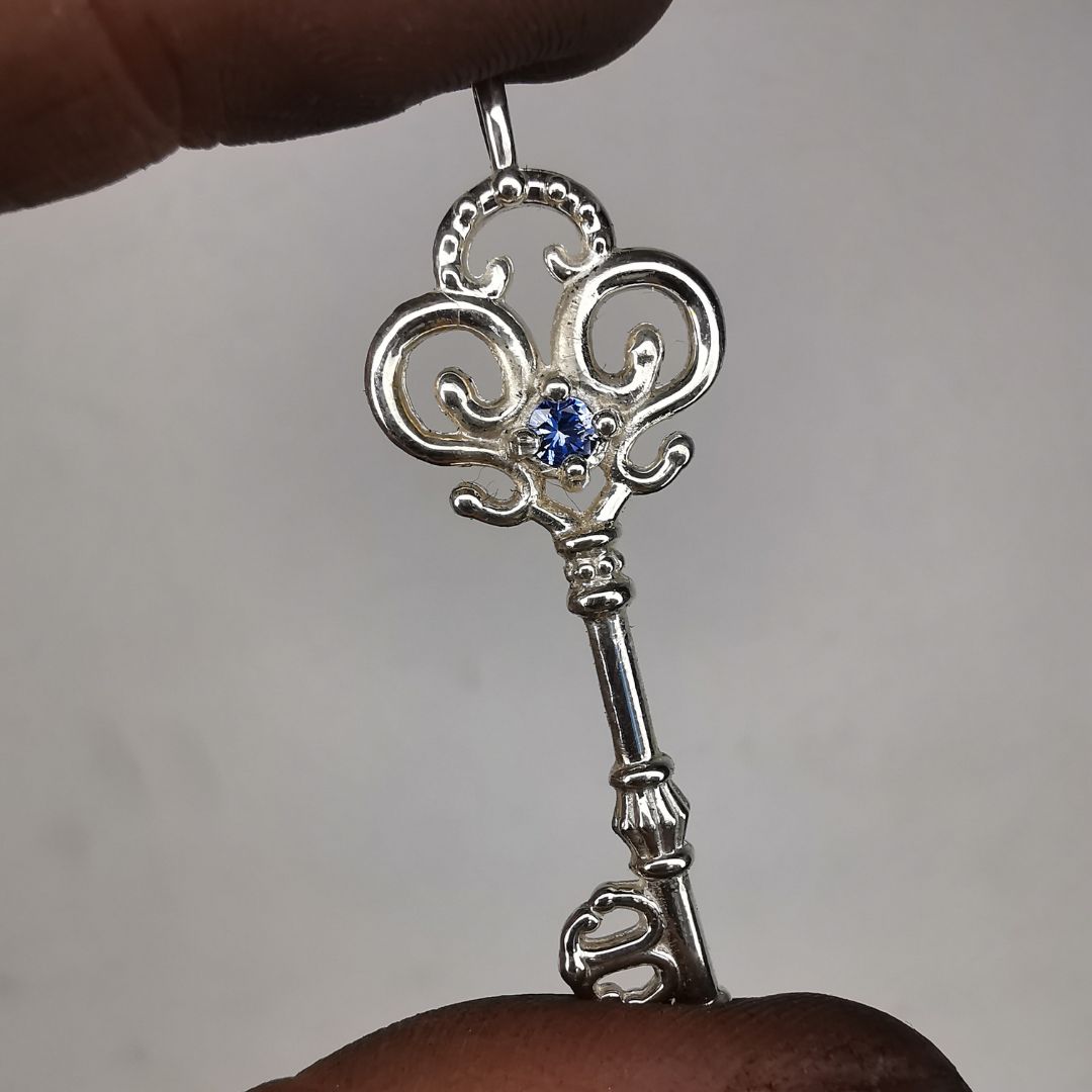 Silver Key Pendant With Sapphire