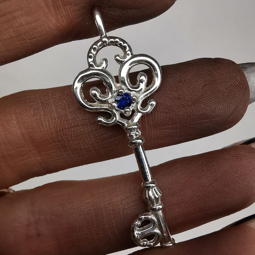 Silver Key Pendant With Sapphire