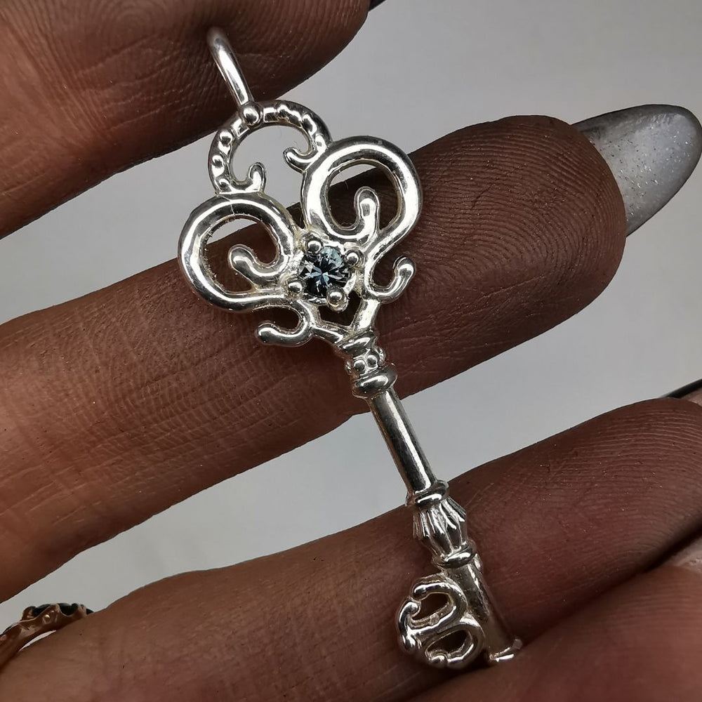 Silver Key Pendant With Sapphire