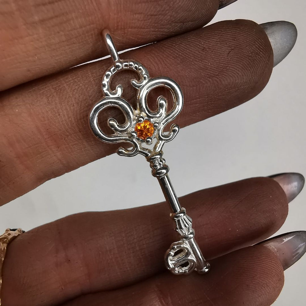 Silver Key Pendant With Sapphire