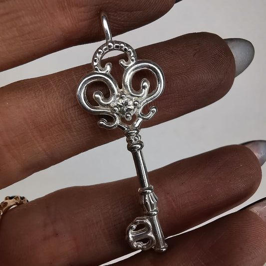 Silver Key Pendant With Sapphire